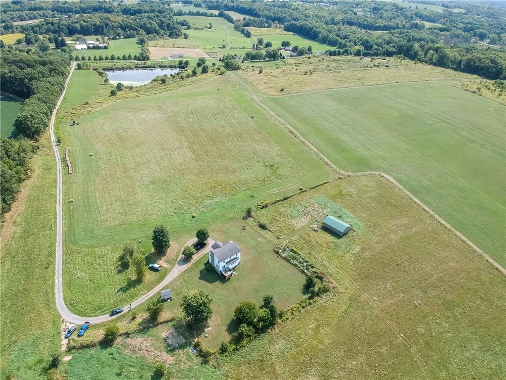 an aerial view of residential houses with outdoor space