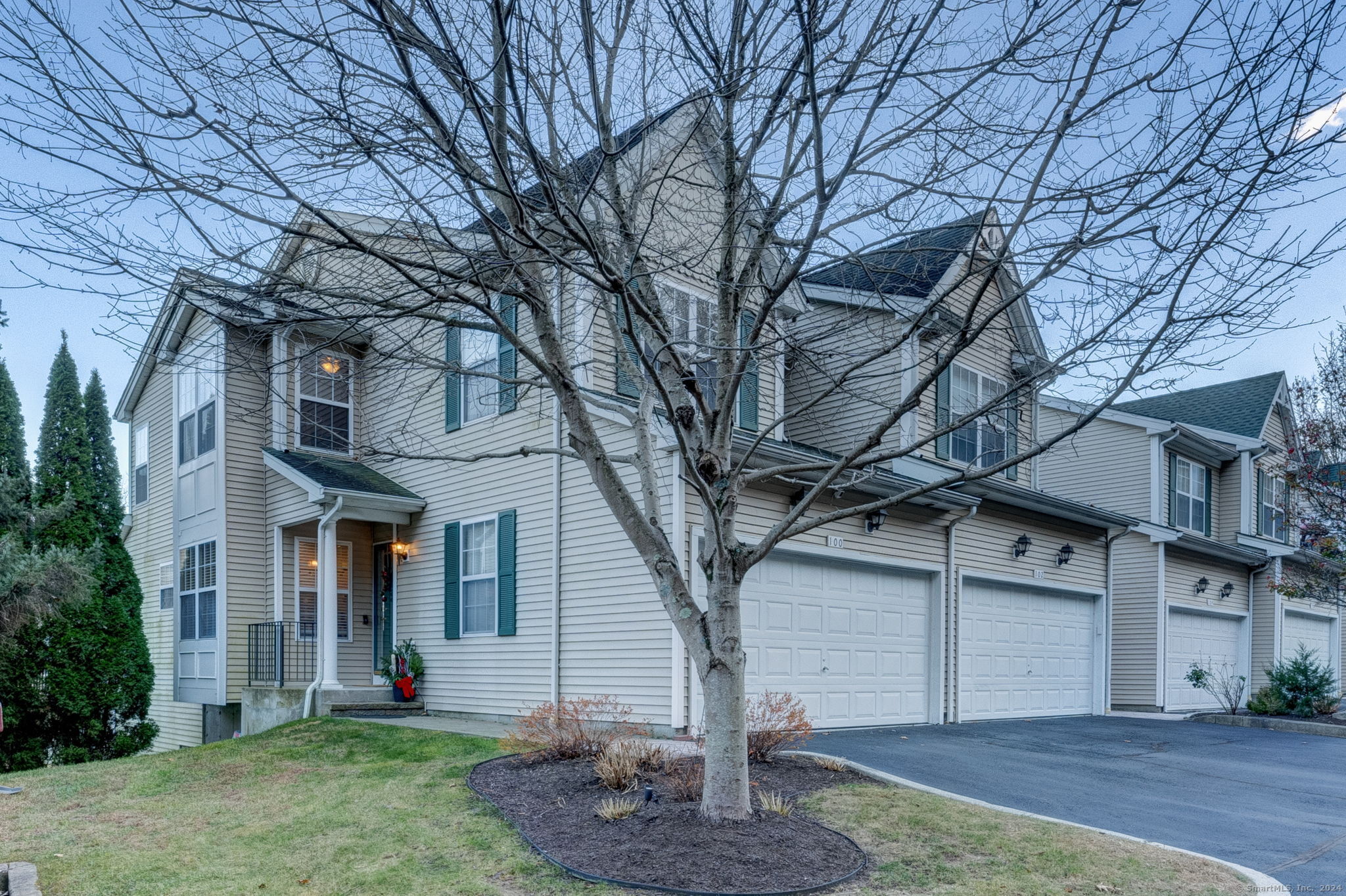 a front view of a house with a yard