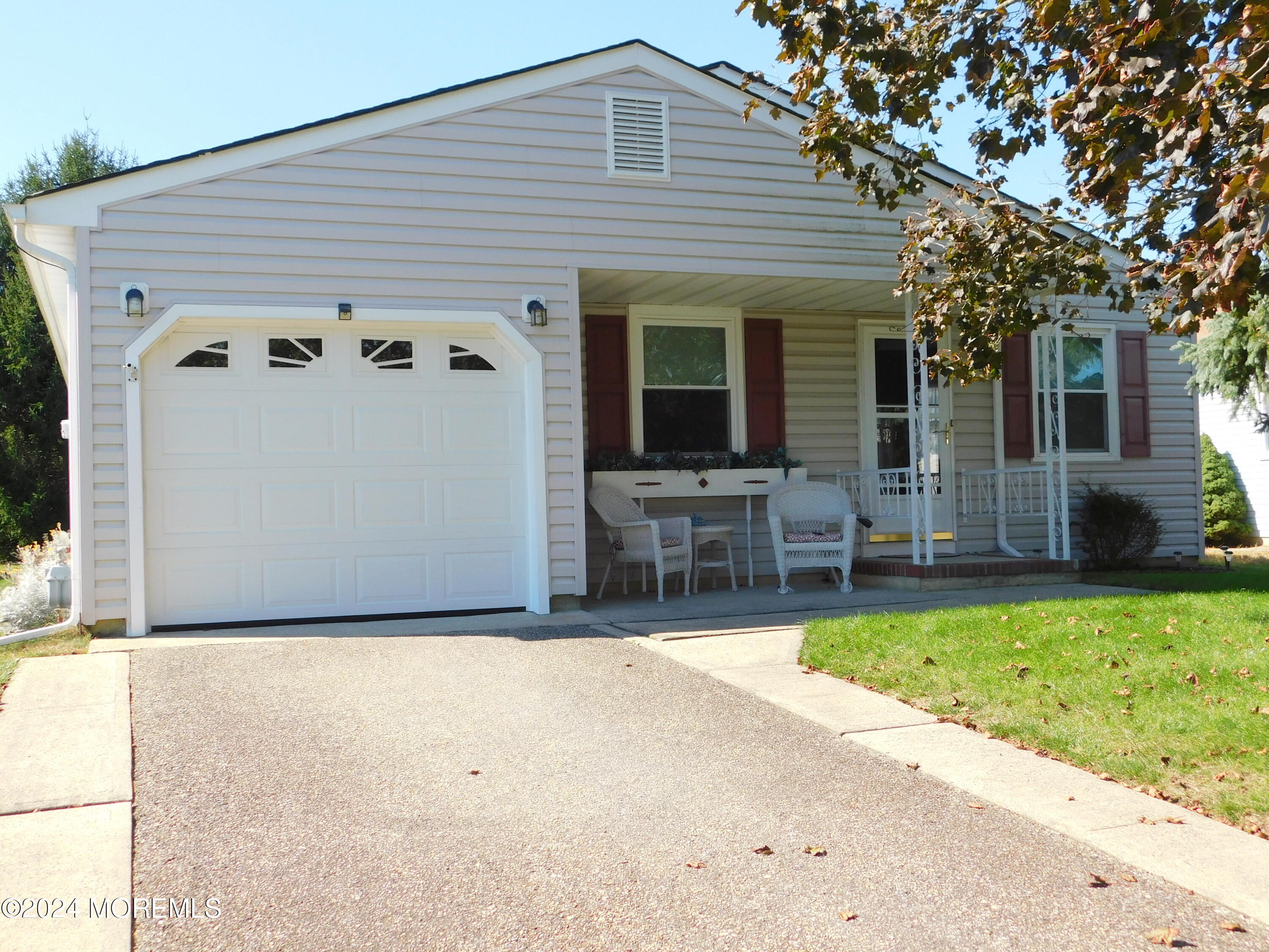 a front view of house with yard outdoor seating and barbeque oven