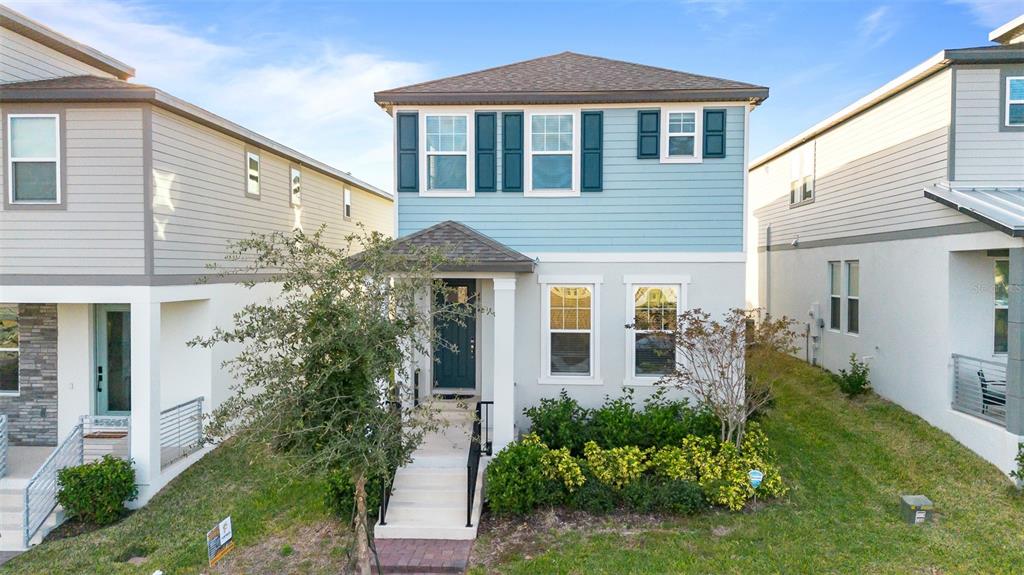 a front view of a house with a yard