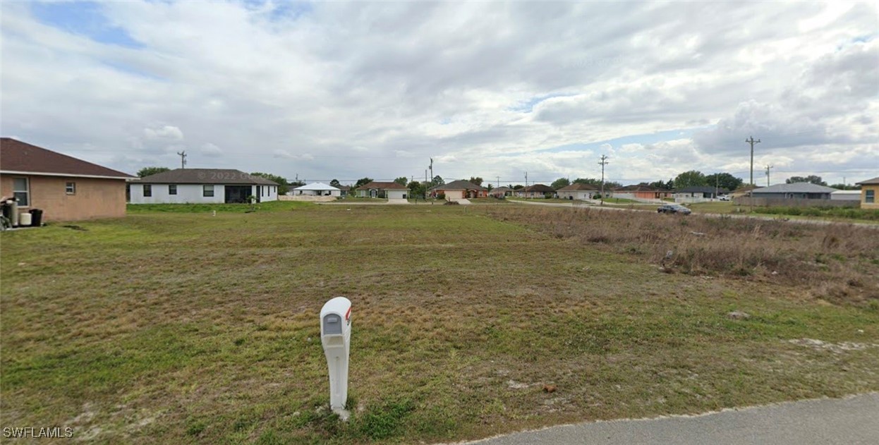 a view of a big yard with an buildings