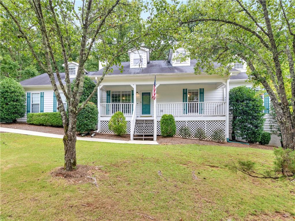 a front view of house with yard and green space