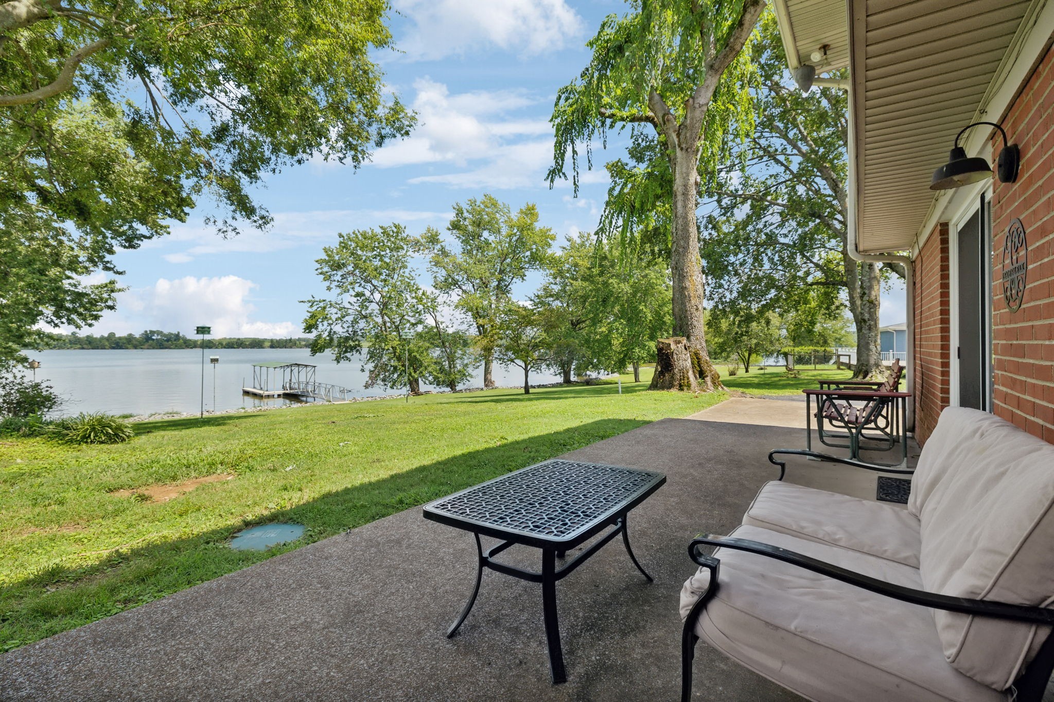 a view of a backyard with sitting area