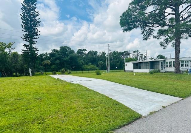 a view of a house with a big yard