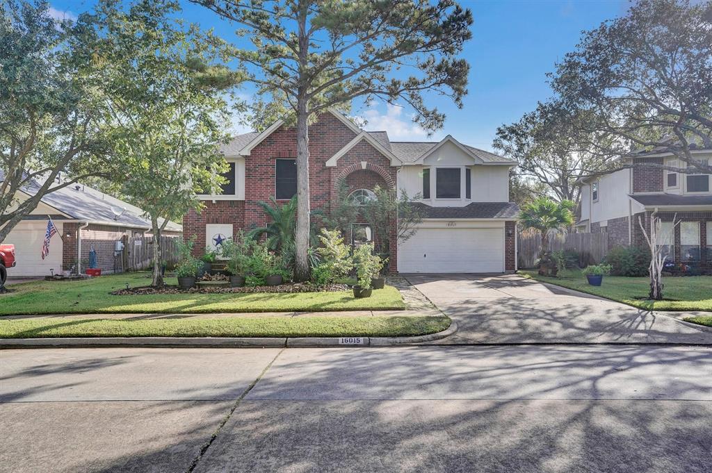 a house that has a tree in front of it