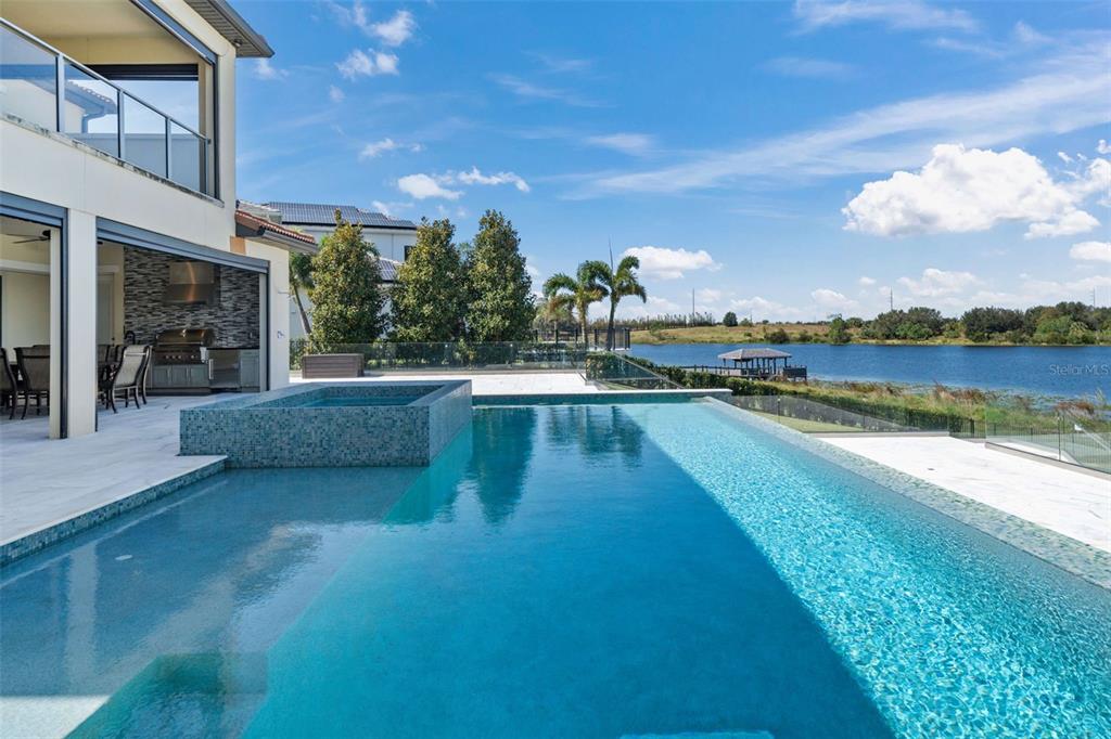 a view of a swimming pool and lounge chair