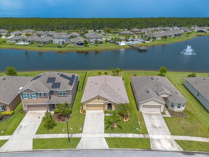 an aerial view of a house with a ocean view