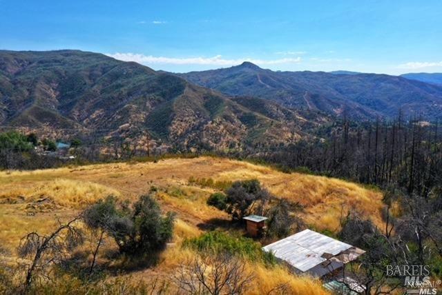 a view of backyard with mountain view