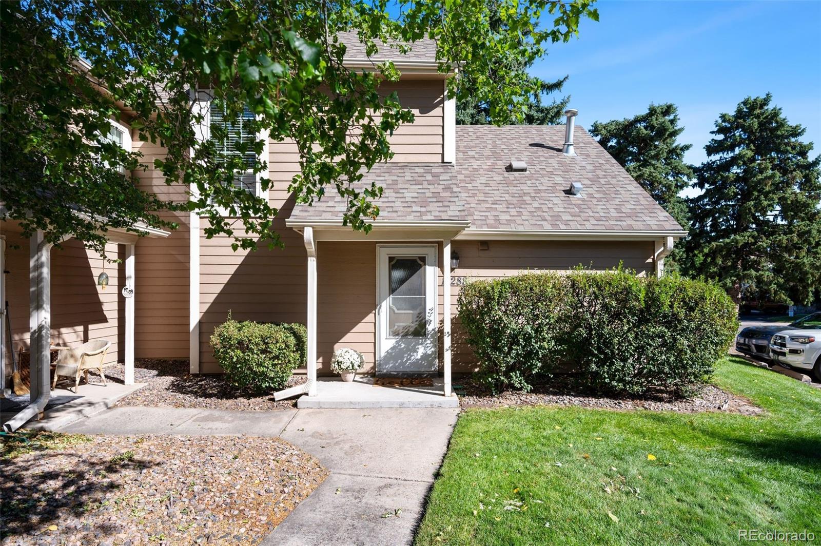 a front view of a house with garden