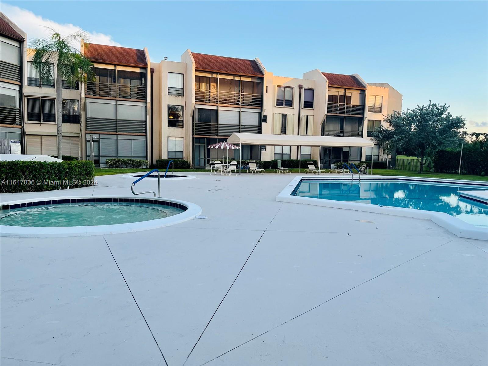 a view of pool with outdoor seating