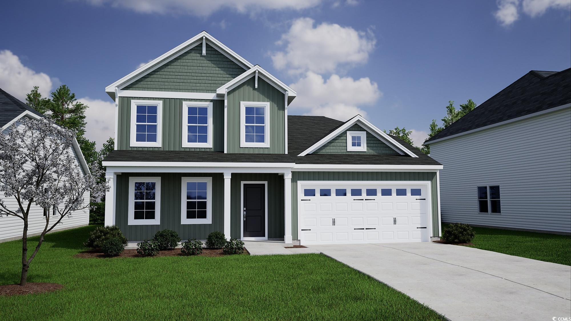 Craftsman inspired home featuring a garage and a f