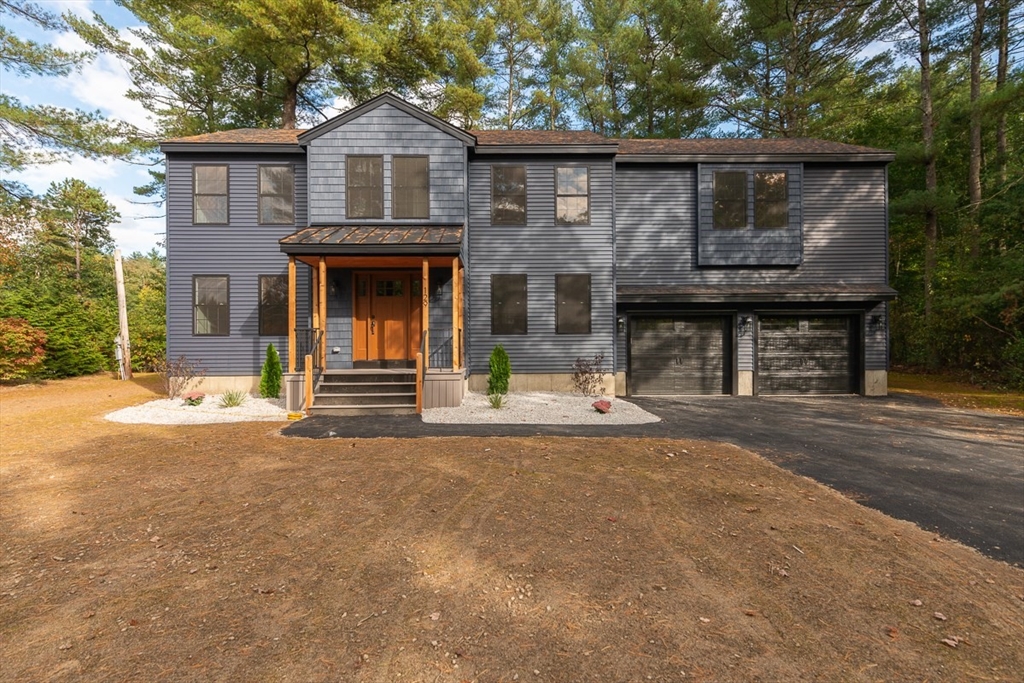 a front view of a house with a garage