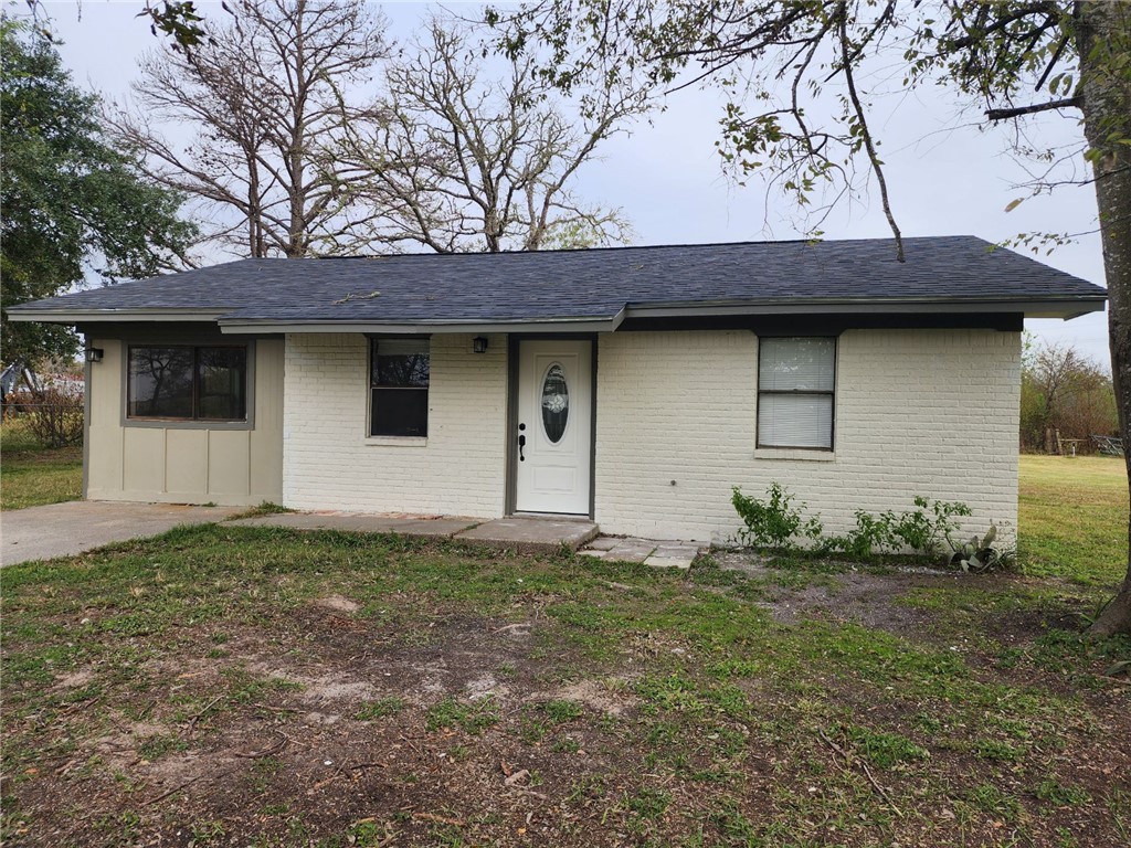 a house with trees in the background