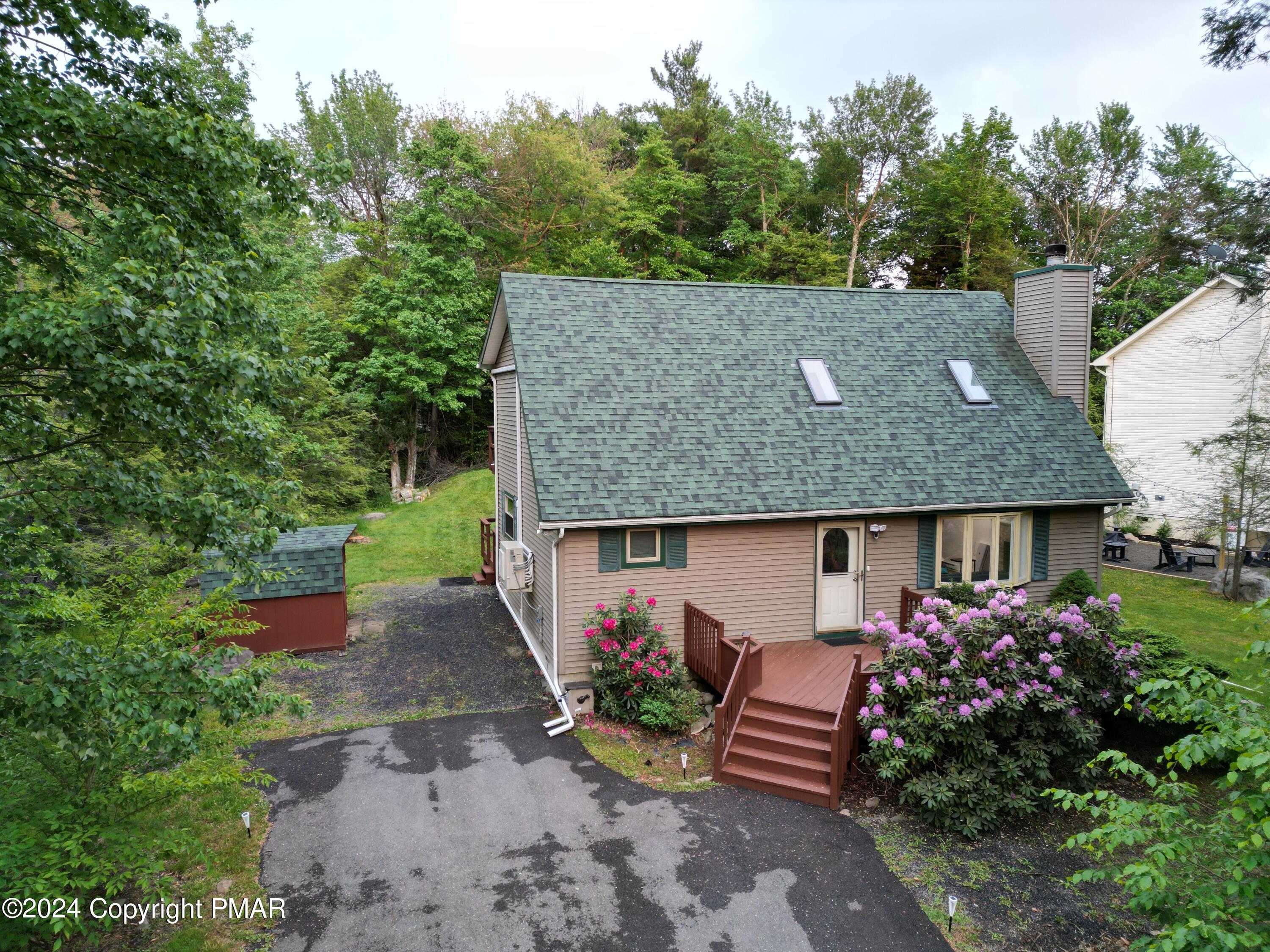 an aerial view of a house with a garden