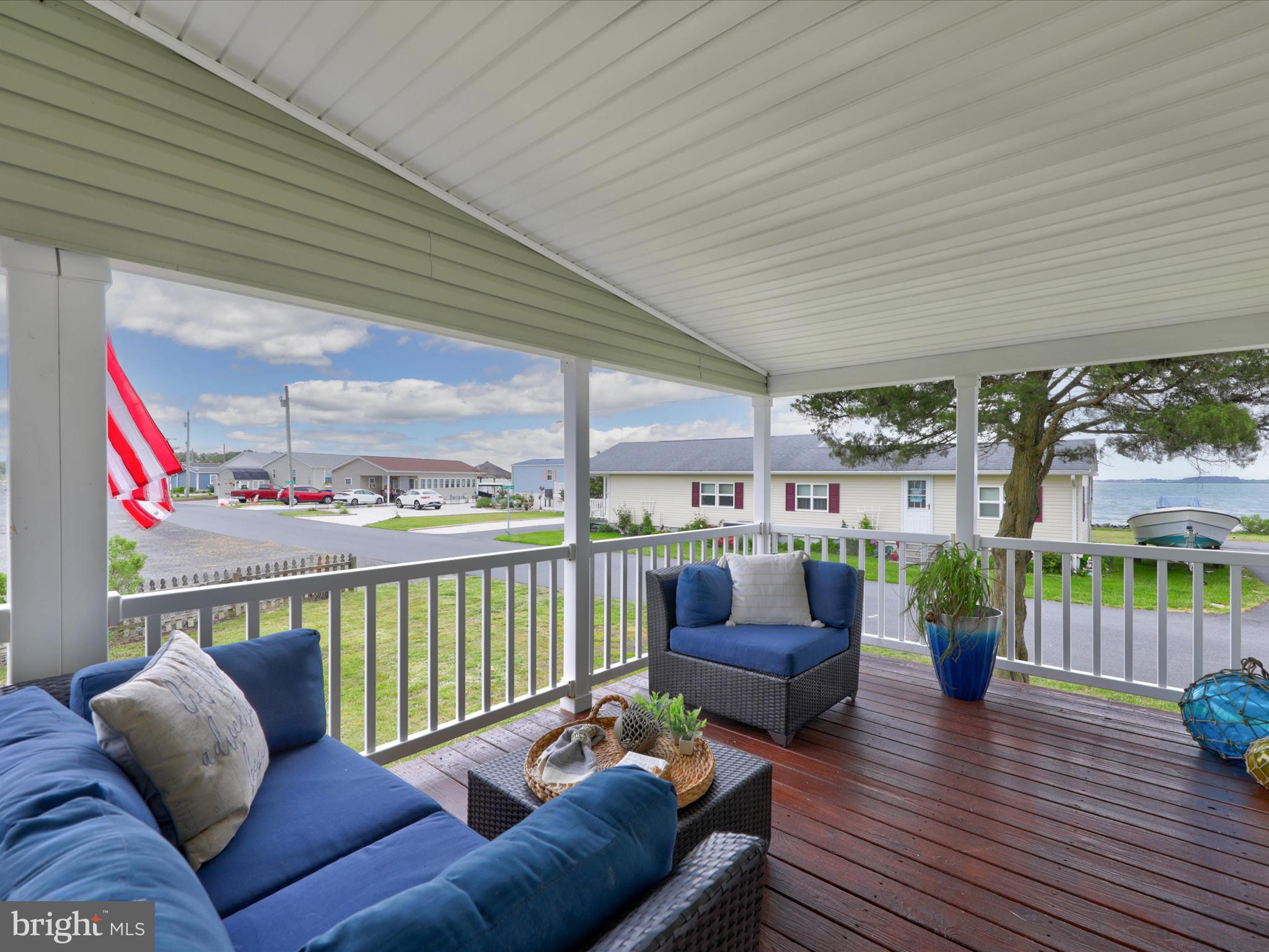 a balcony with furniture and a potted plant