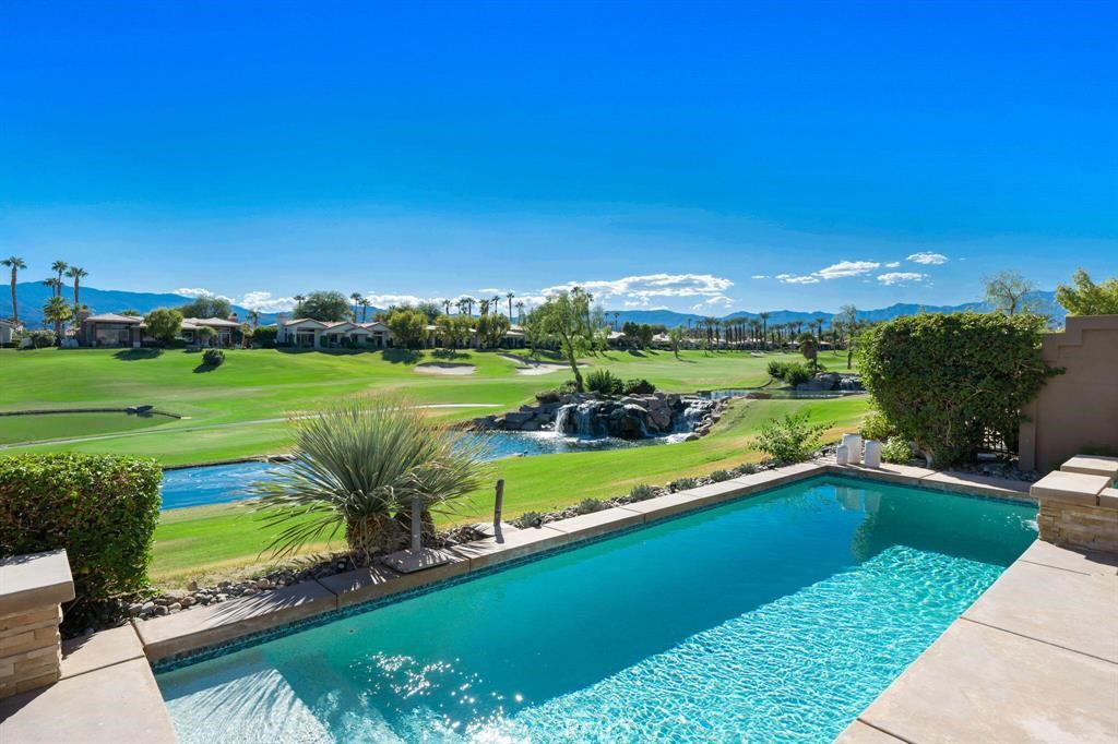 a view of a swimming pool and outdoor space