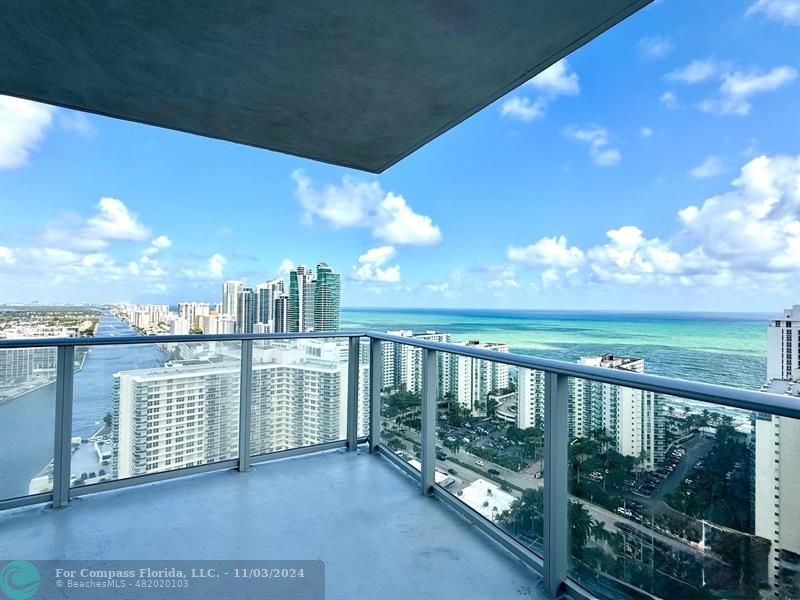 a view of a balcony with city view