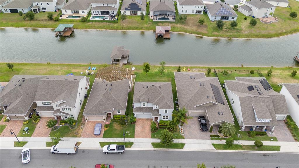 an aerial view of a house with a swimming pool