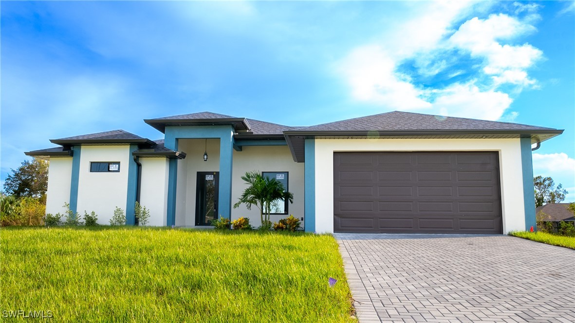 a front view of a house with a yard