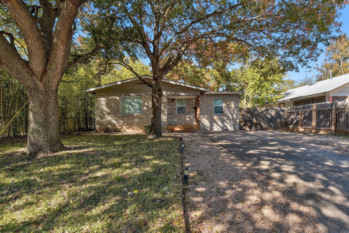 a view of a house with a tree