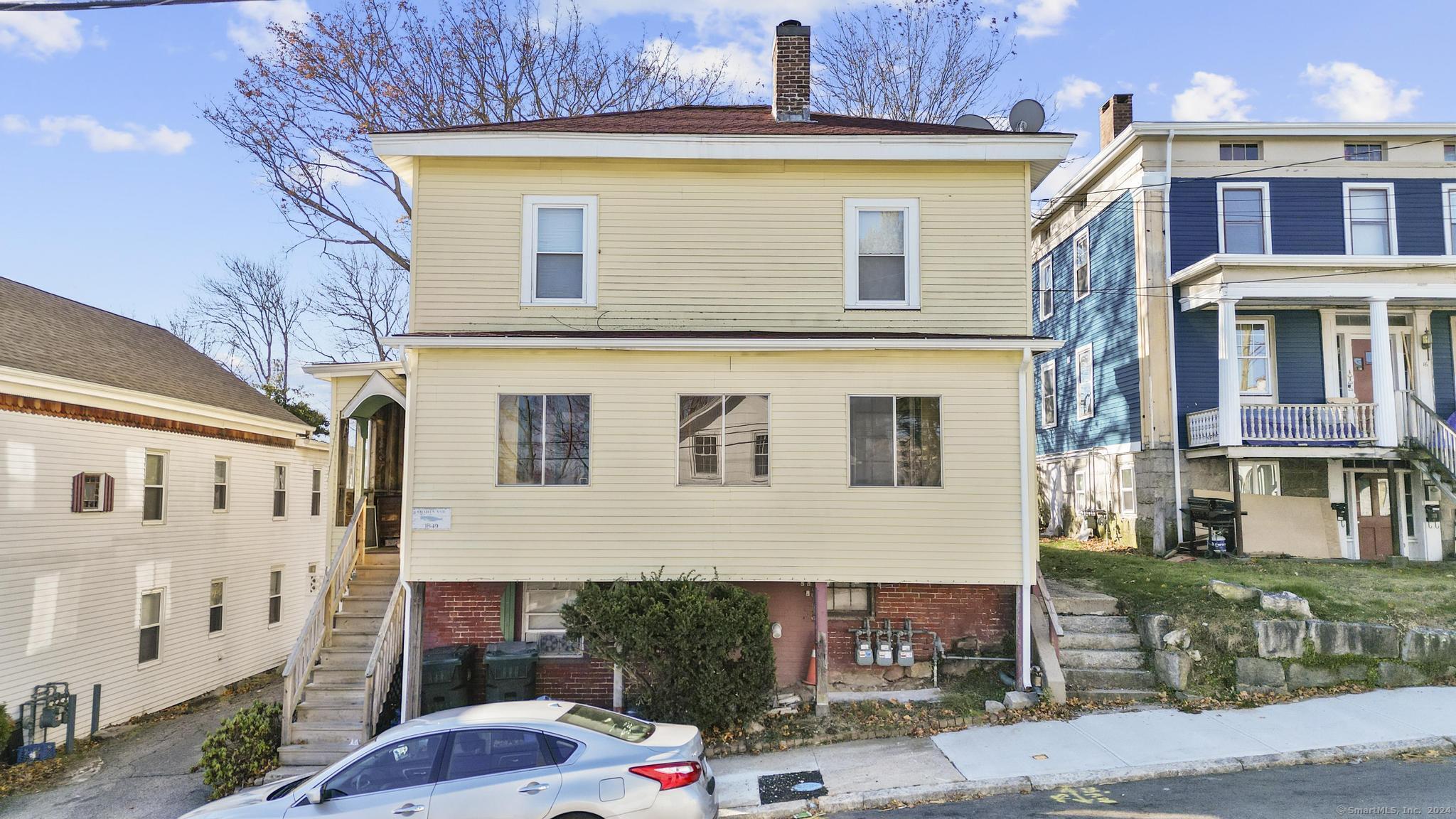 a front view of a house with a yard