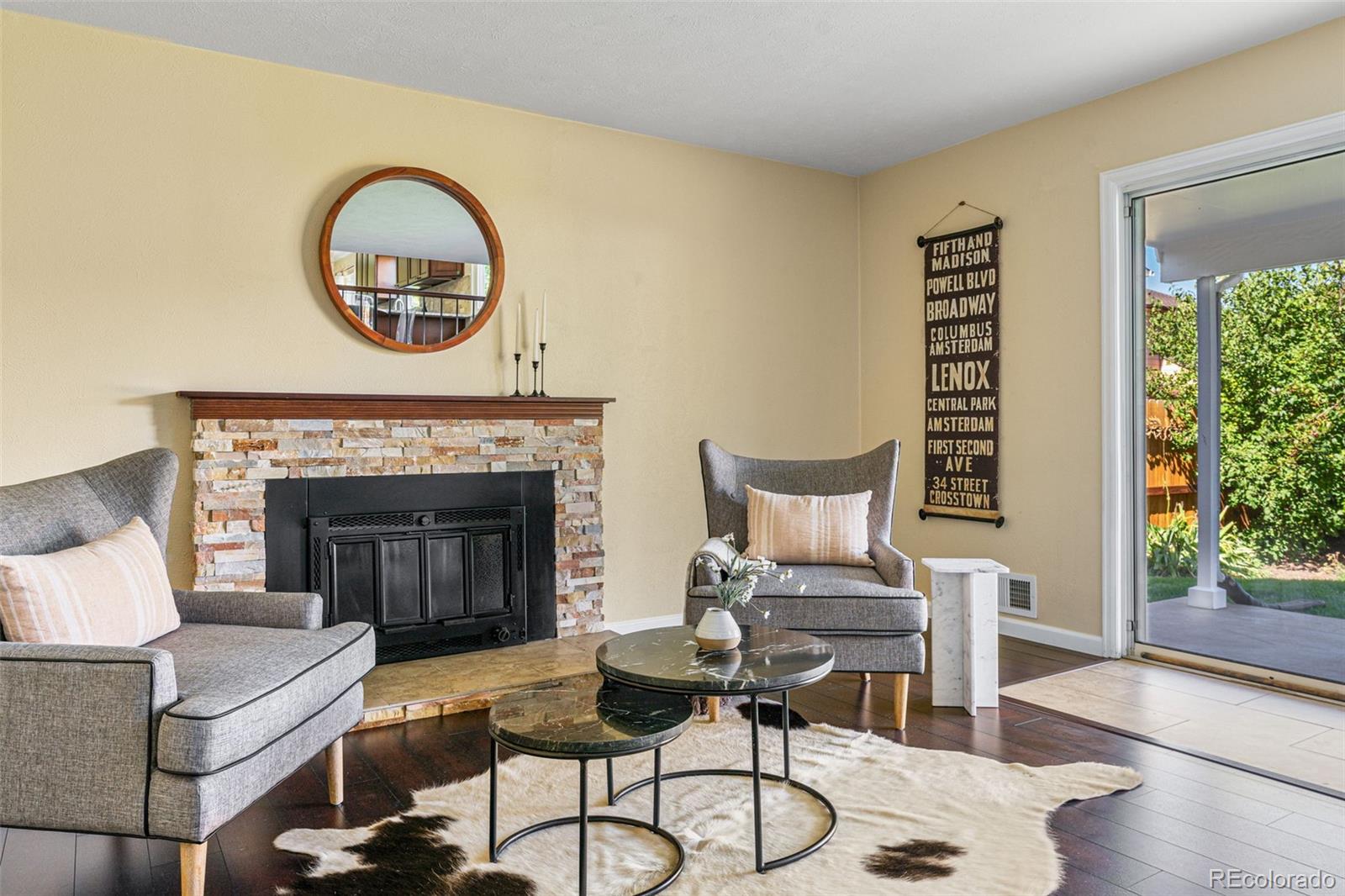 a living room with furniture and a fireplace