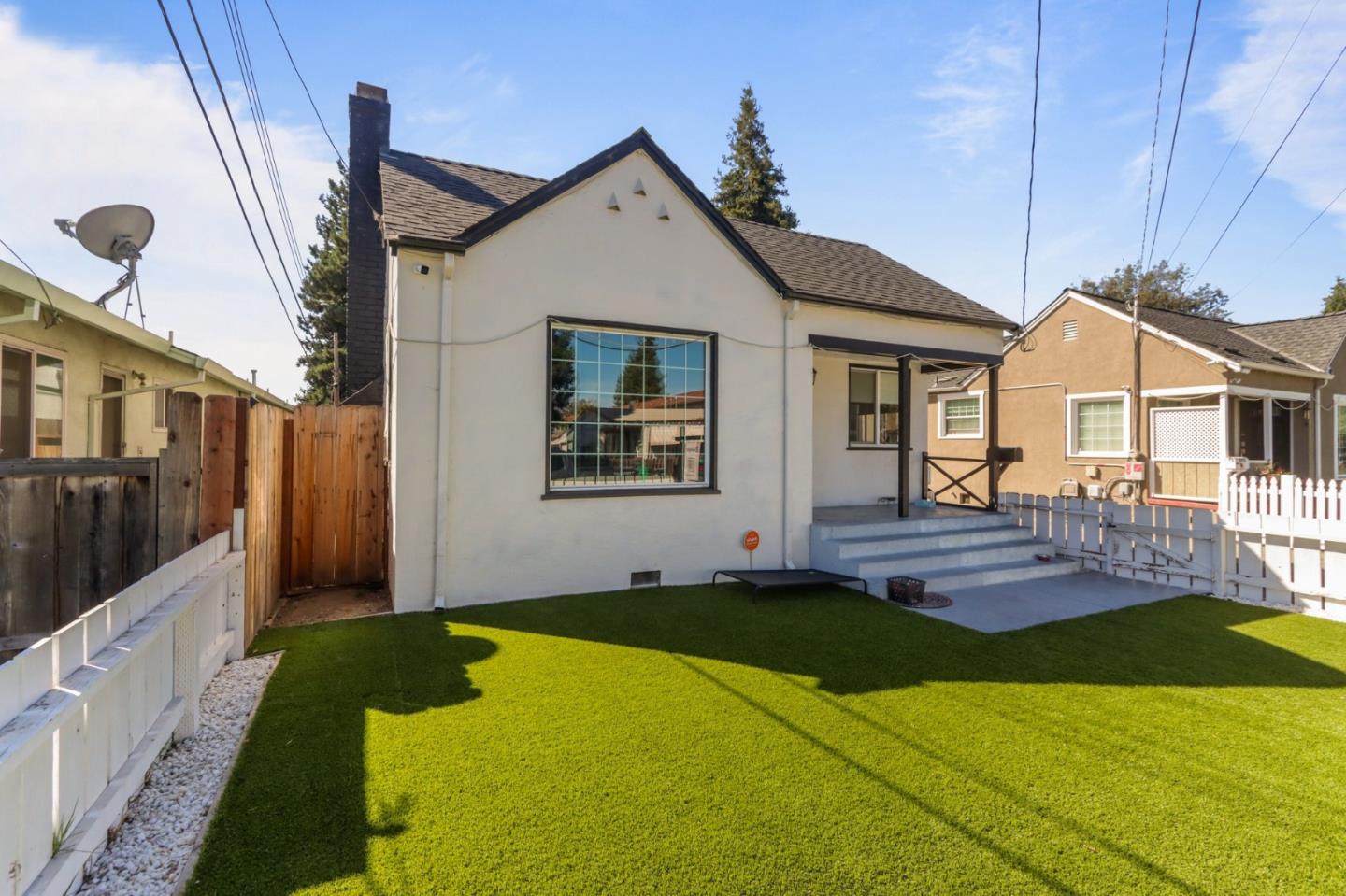 a front view of a house with yard