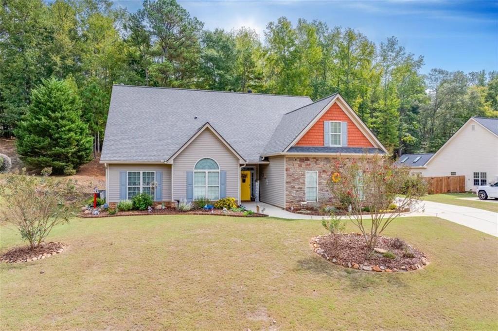 a front view of a house with a yard