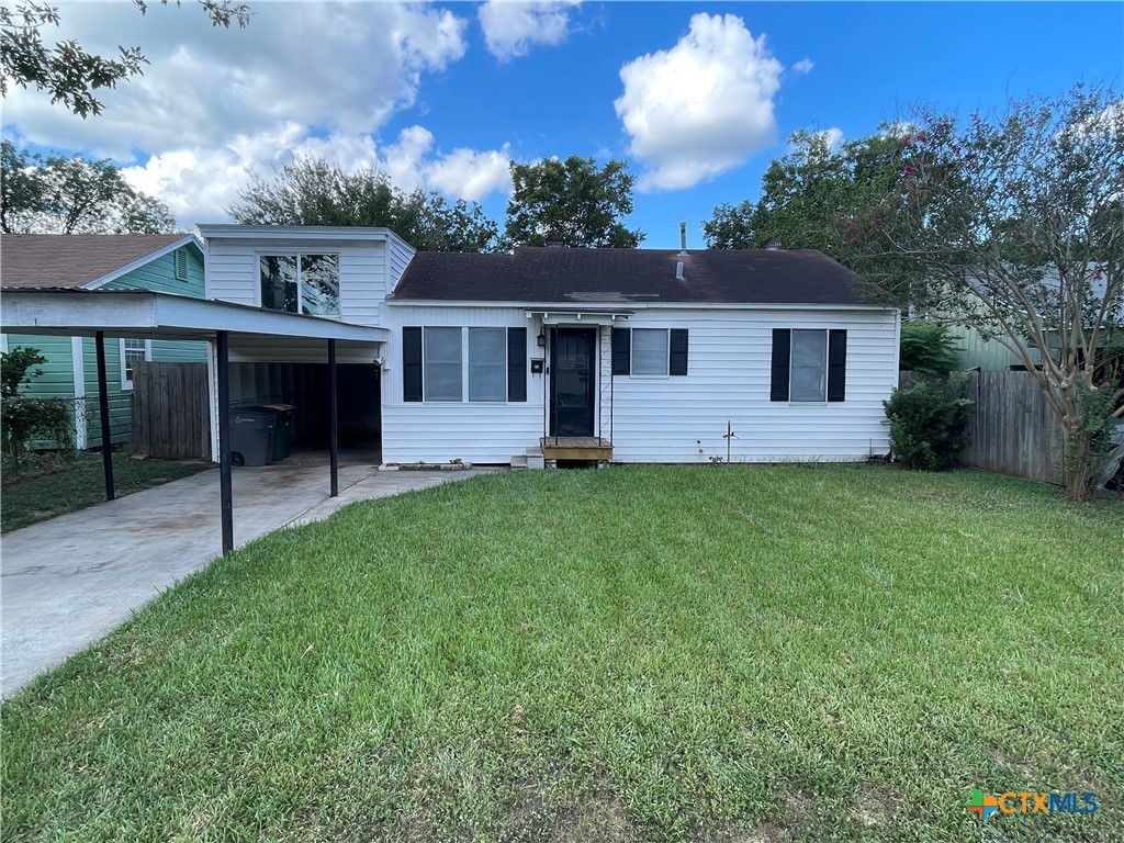 front view of a house with a yard