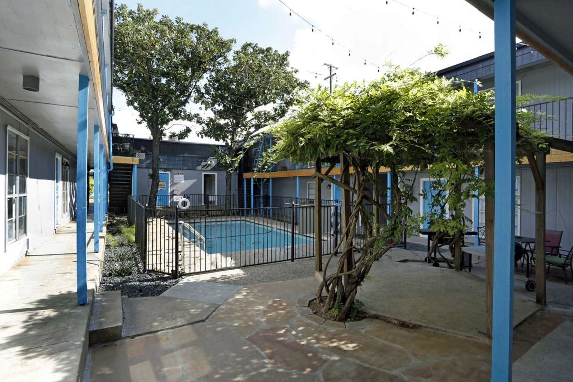 a view of a house with backyard and porch