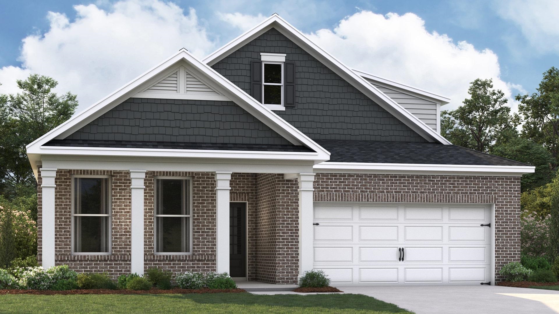 View of front facade featuring a front yard and a garage