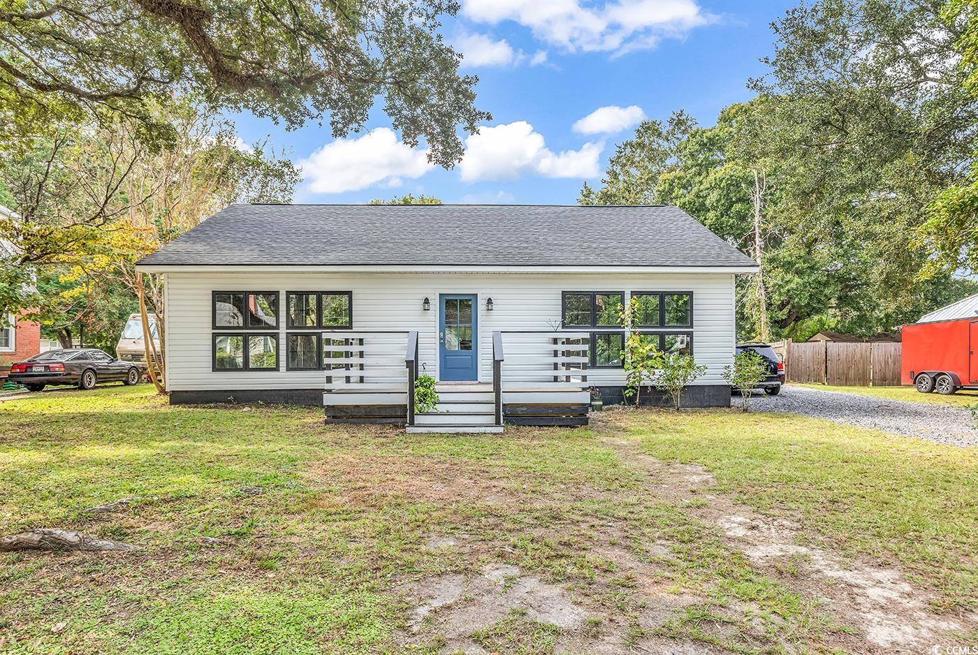 View of front of house with a front yard