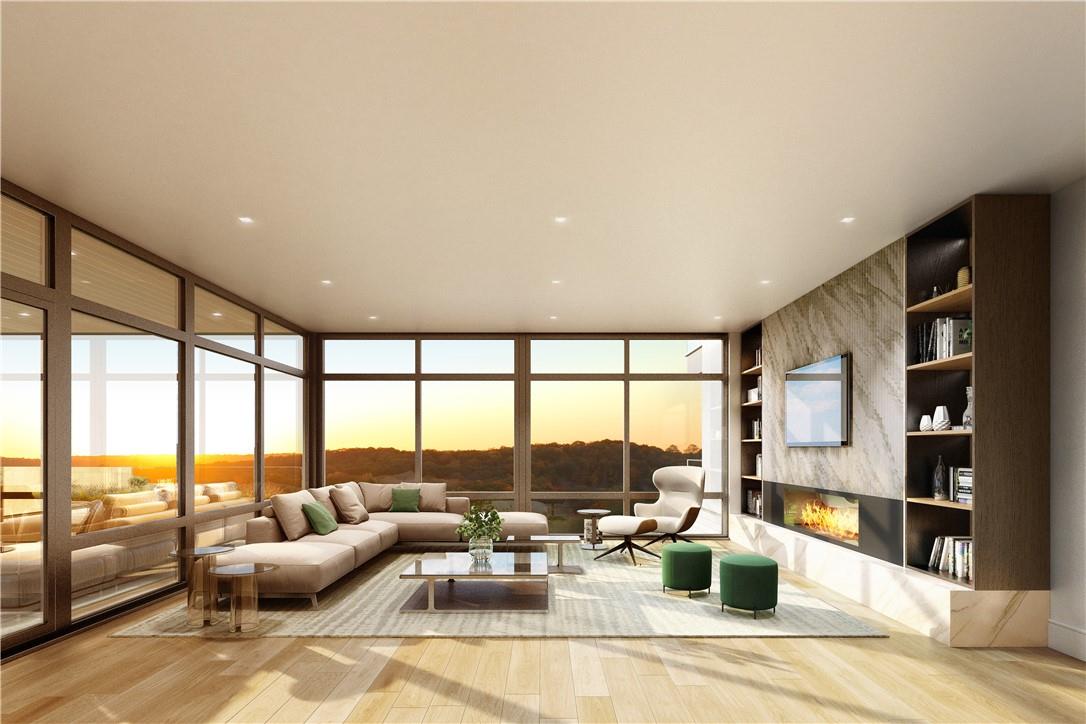 a living room with furniture and floor to ceiling windows