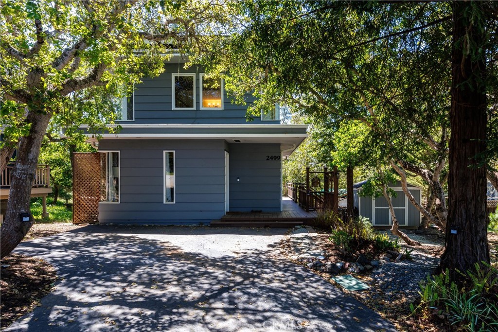 a house with trees in front of it