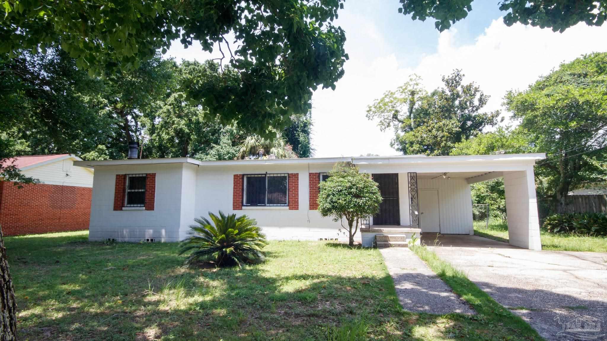 front view of a house with a yard