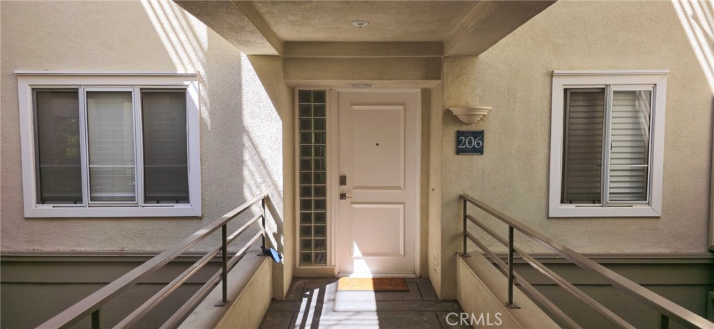 a view of an entryway with wooden floor and stairs