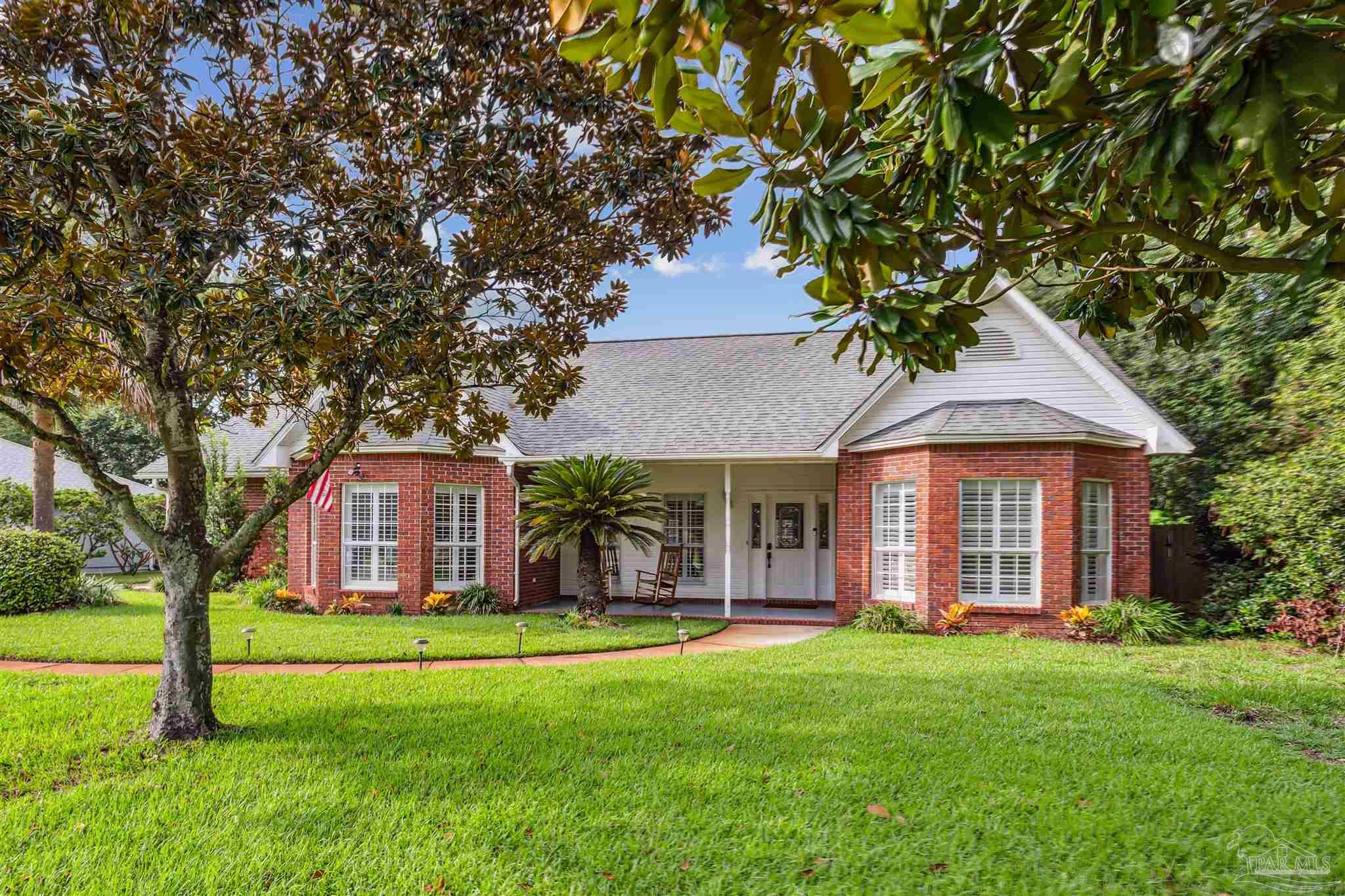 front view of a house with a yard