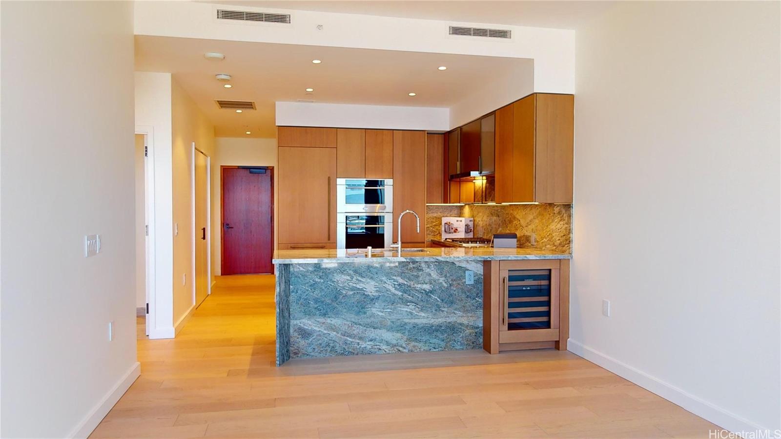 a view of kitchen with kitchen island dining room and living room