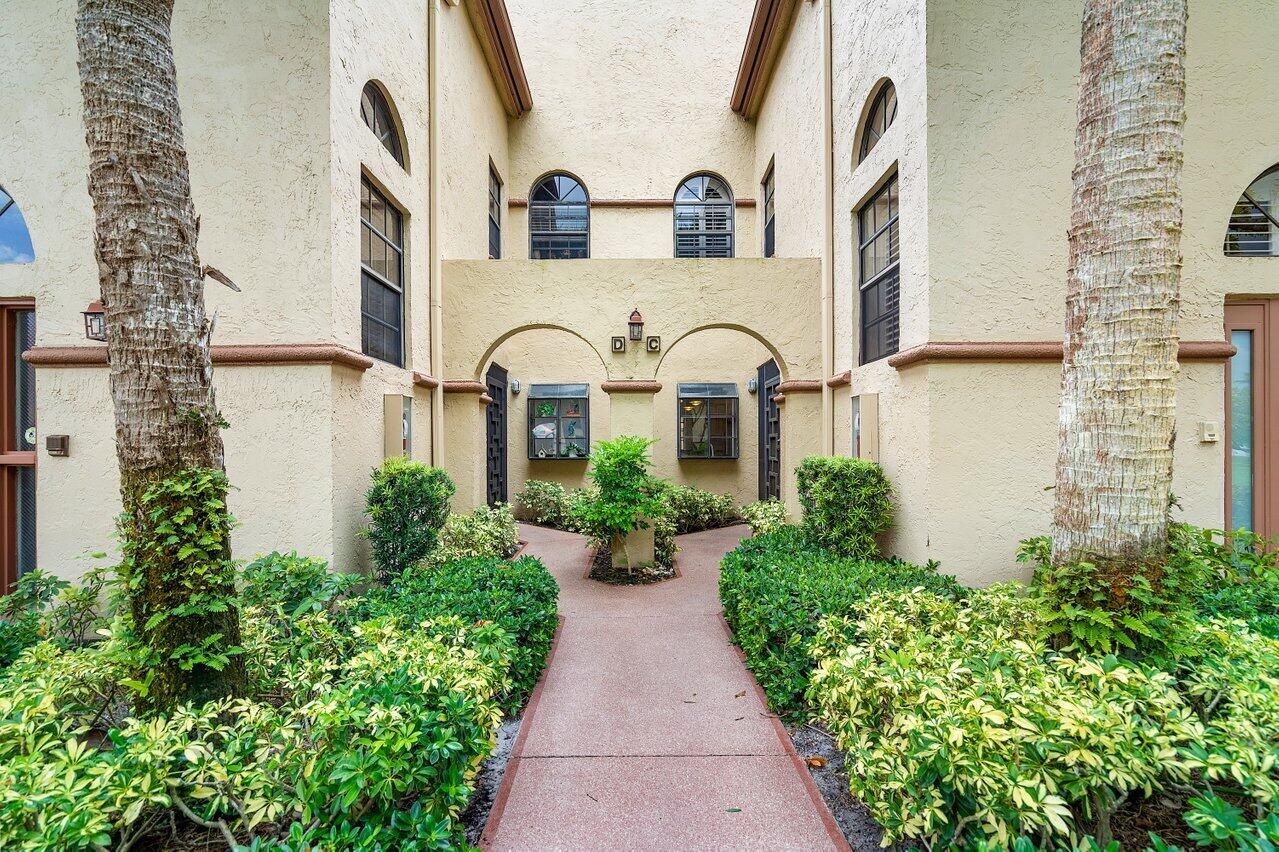 front view of house with potted plants