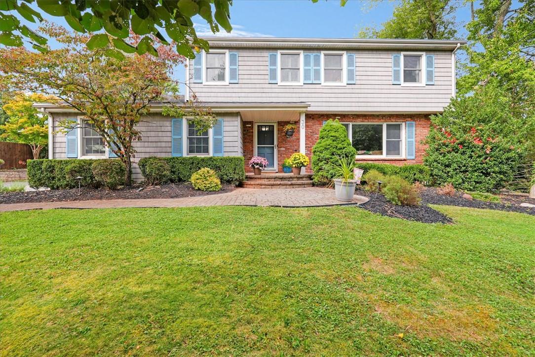 front view of a house with a yard