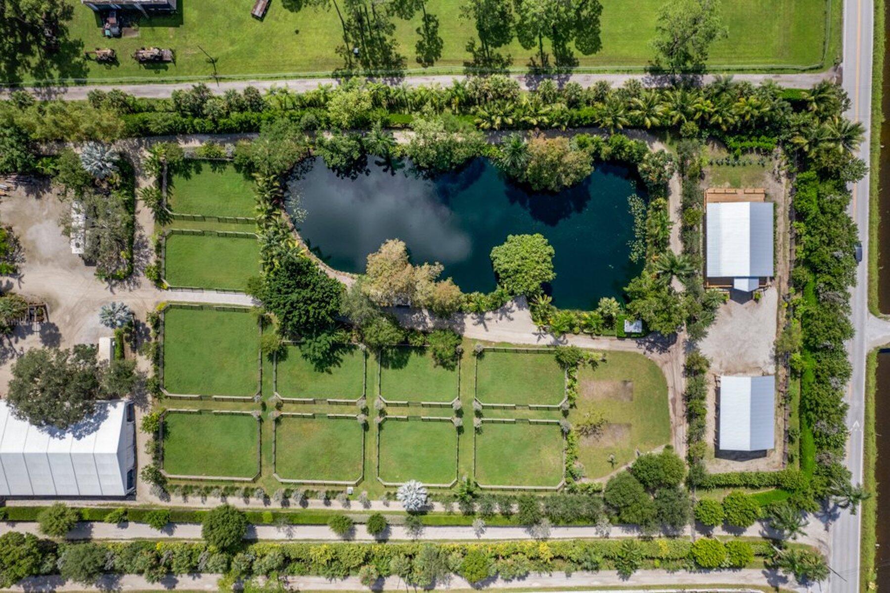 an aerial view of a house with a lake view