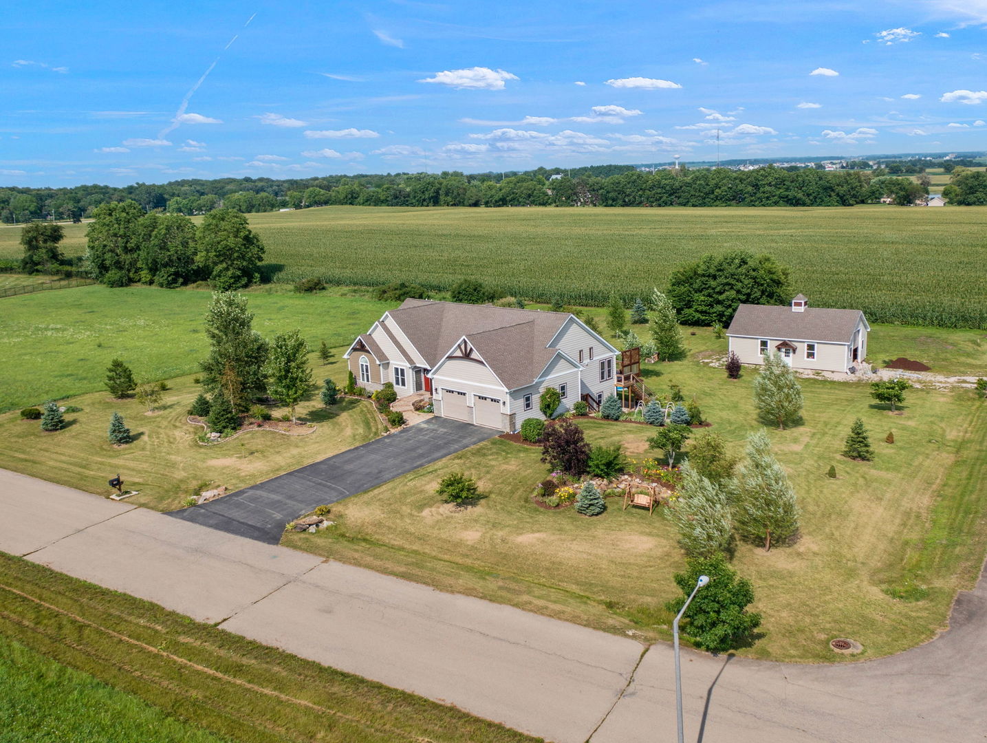 an aerial view of a house with a lake view