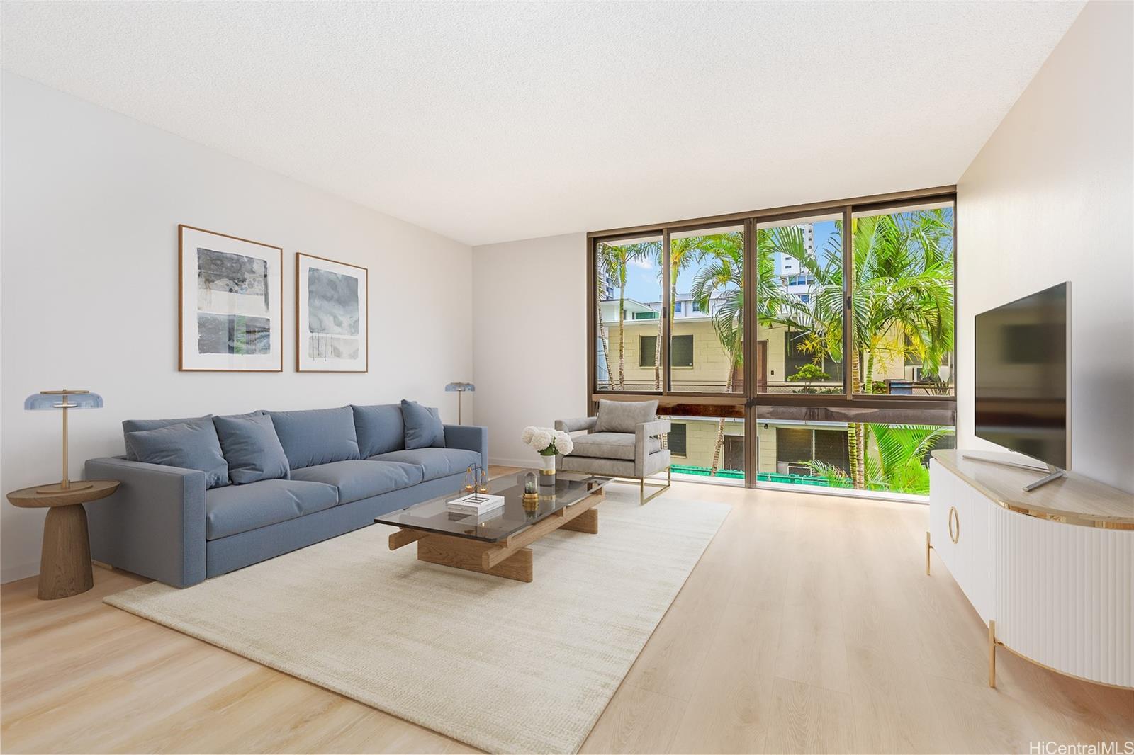 a living room with furniture and a flat screen tv