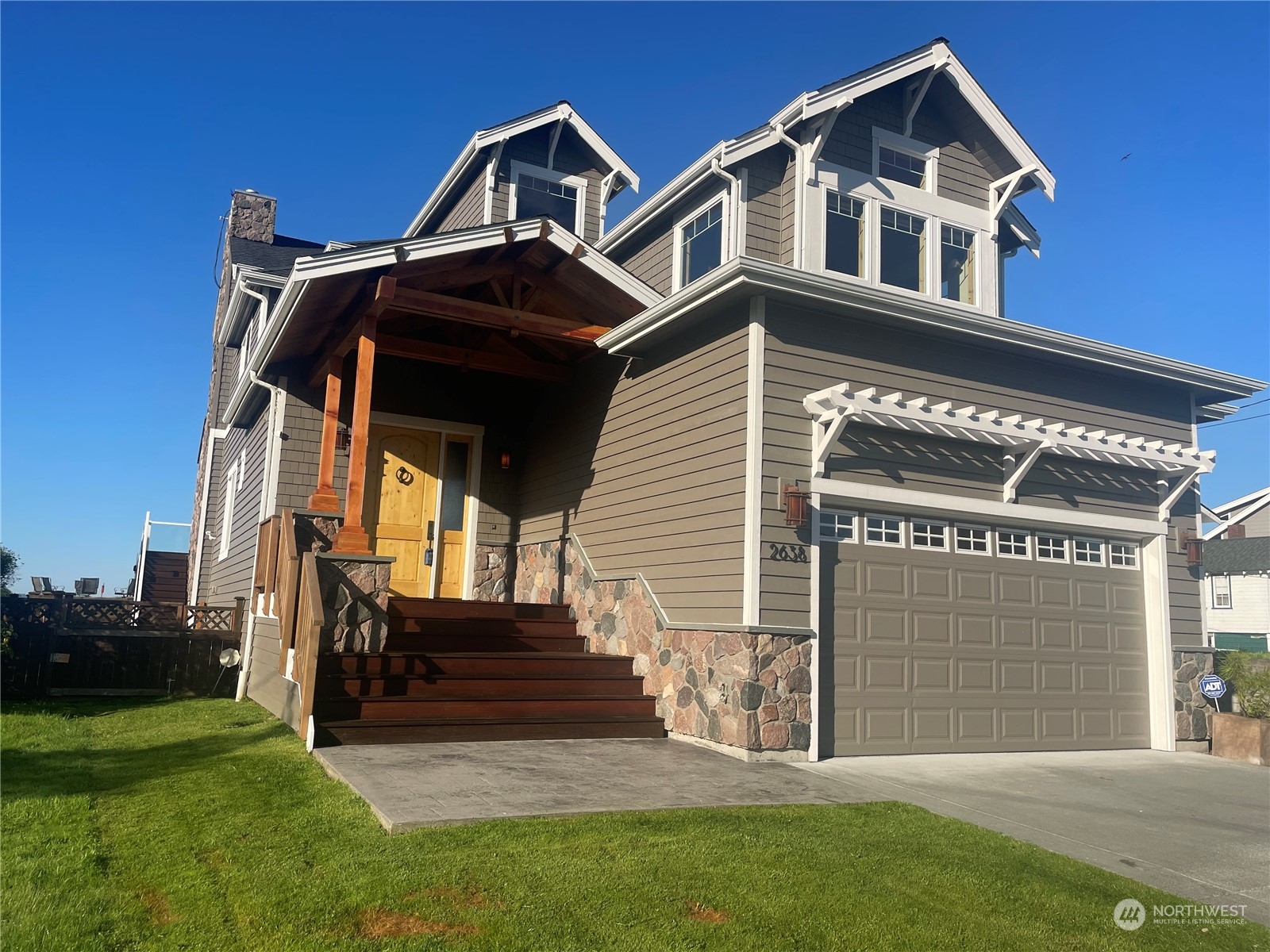 a front view of a house with a yard