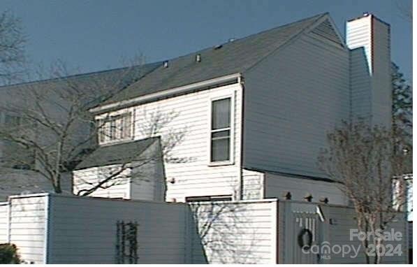 a view of a house with a tree