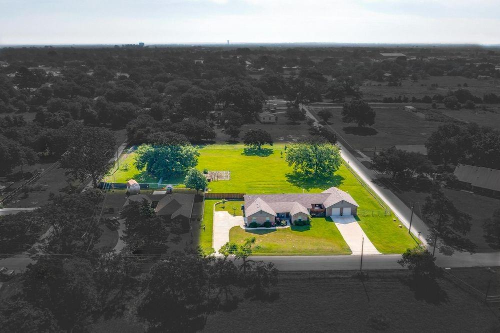 a view of a pool with a yard