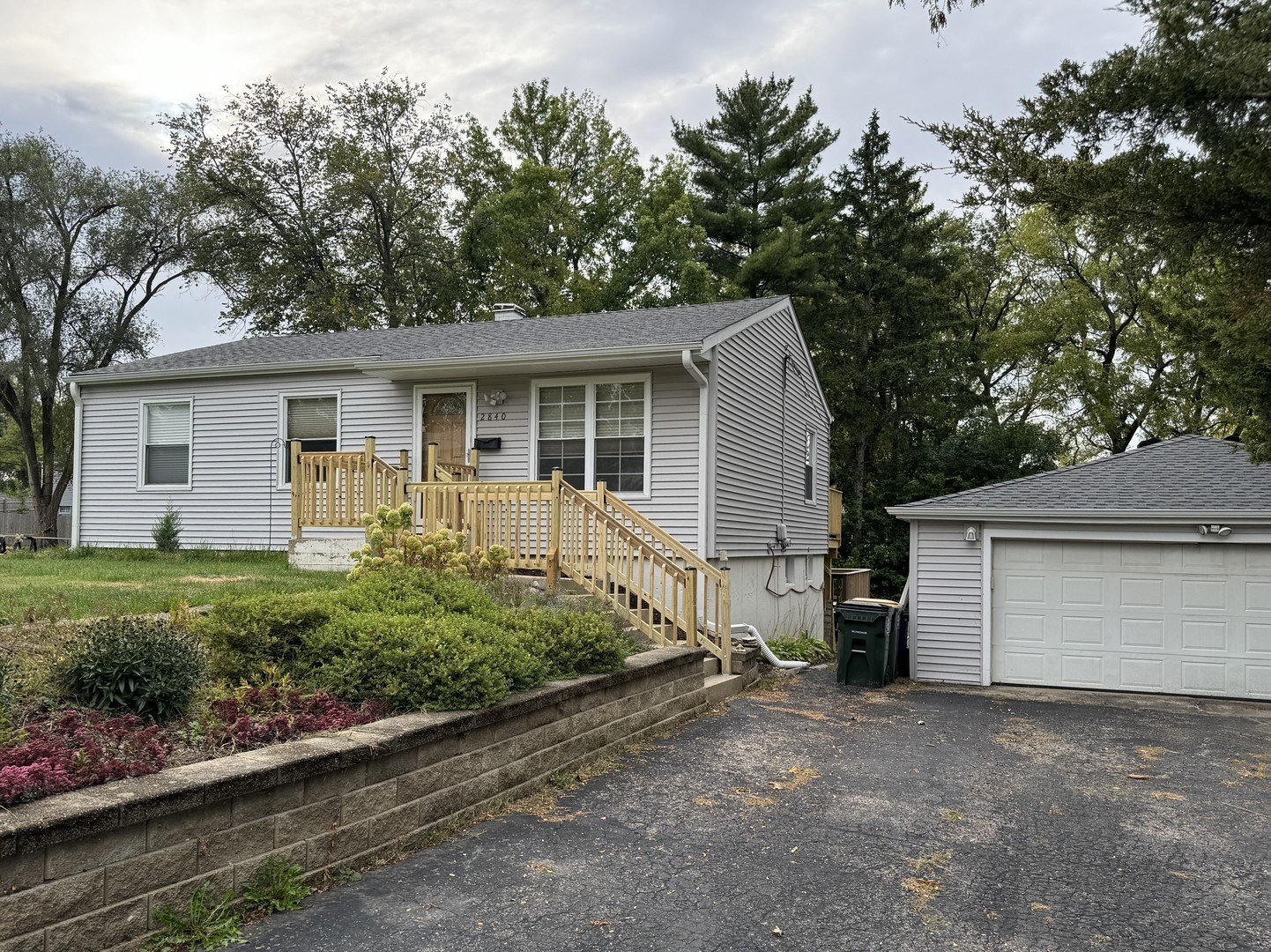 a view of a house with a yard and garage