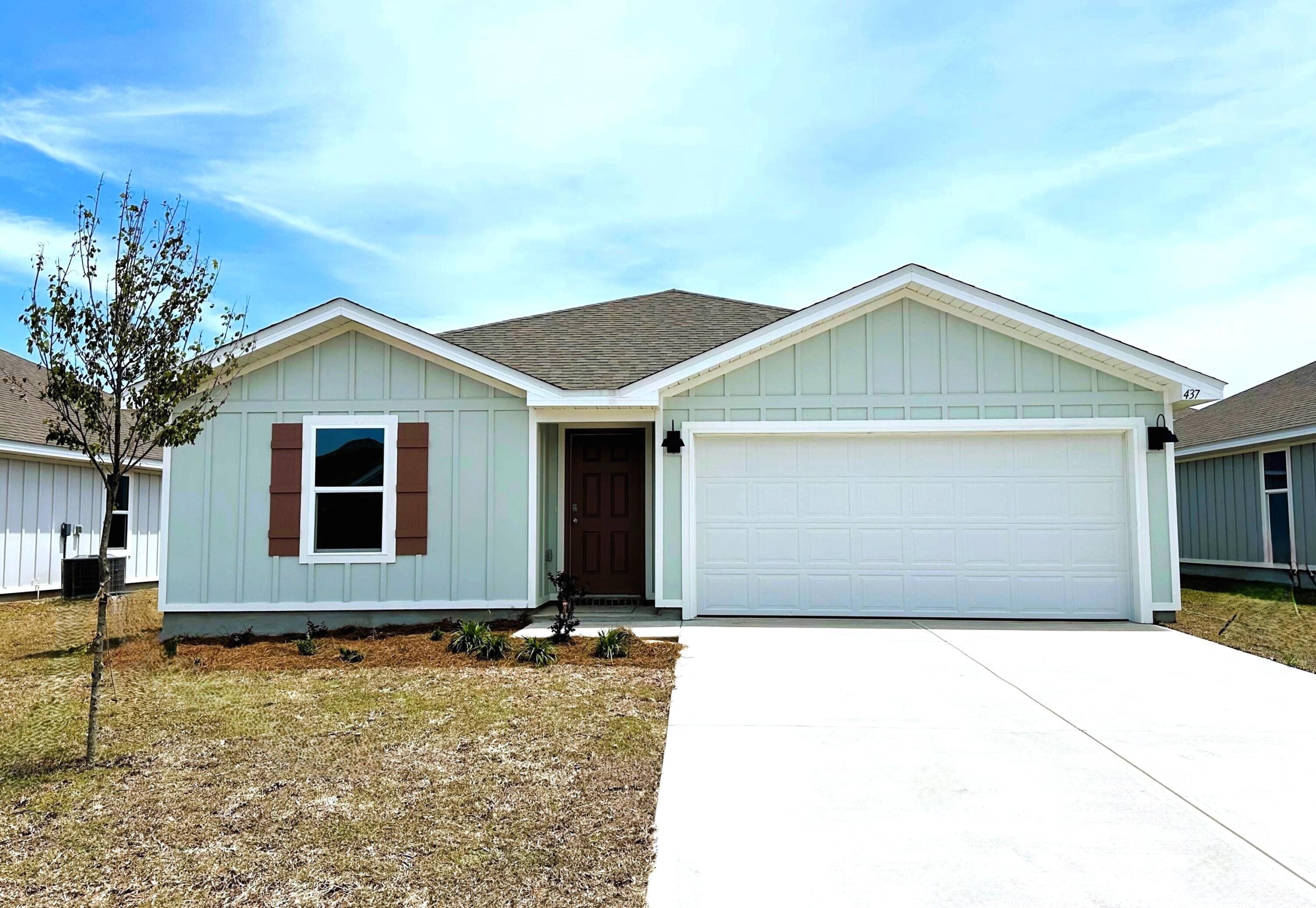 a front view of a house with yard