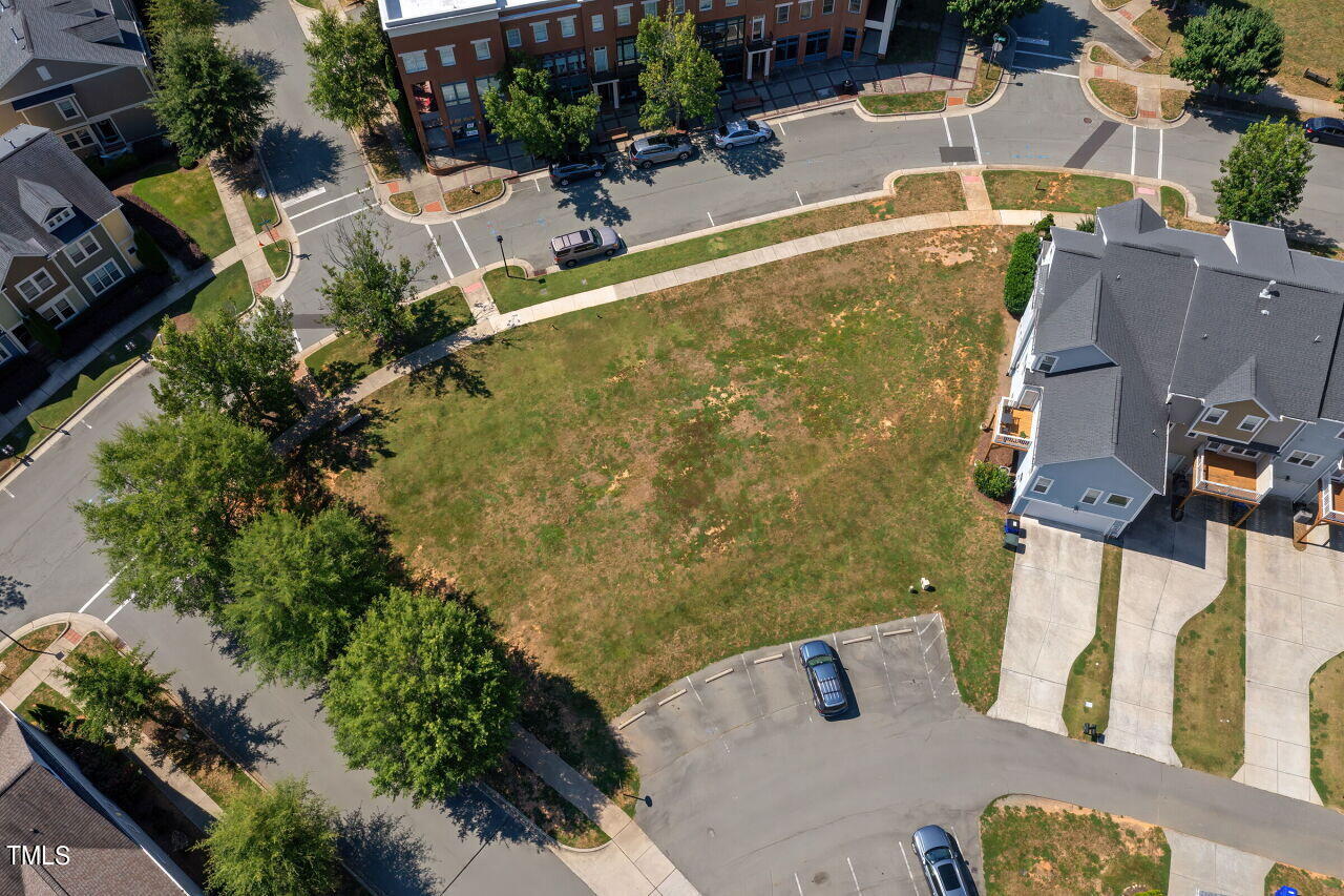 an aerial view of a house with swimming pool