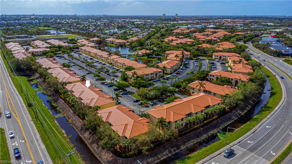 an aerial view of residential houses with outdoor space and river